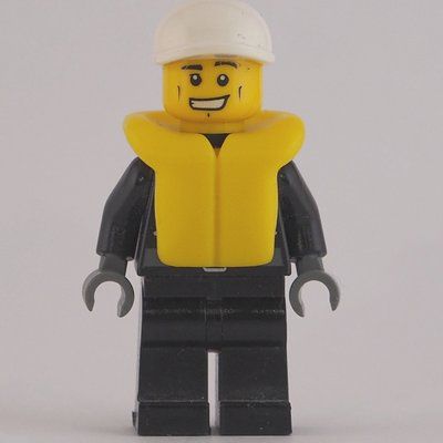 Minifiguur Policeman, Black Jacket with Zipper, Radio, Badge, and 'POLICE' on Back, White Cap, Yellow Life Vest uit set 7287