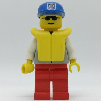 Minifigure Coast Guard, Light Gray Jacket with Zipper and Badge, Blue Cap with Badge, Yellow Life Vest, Sunglasses del set 6338
